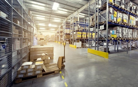 Large warehouse facility with hundreds of boxes on several shelves.